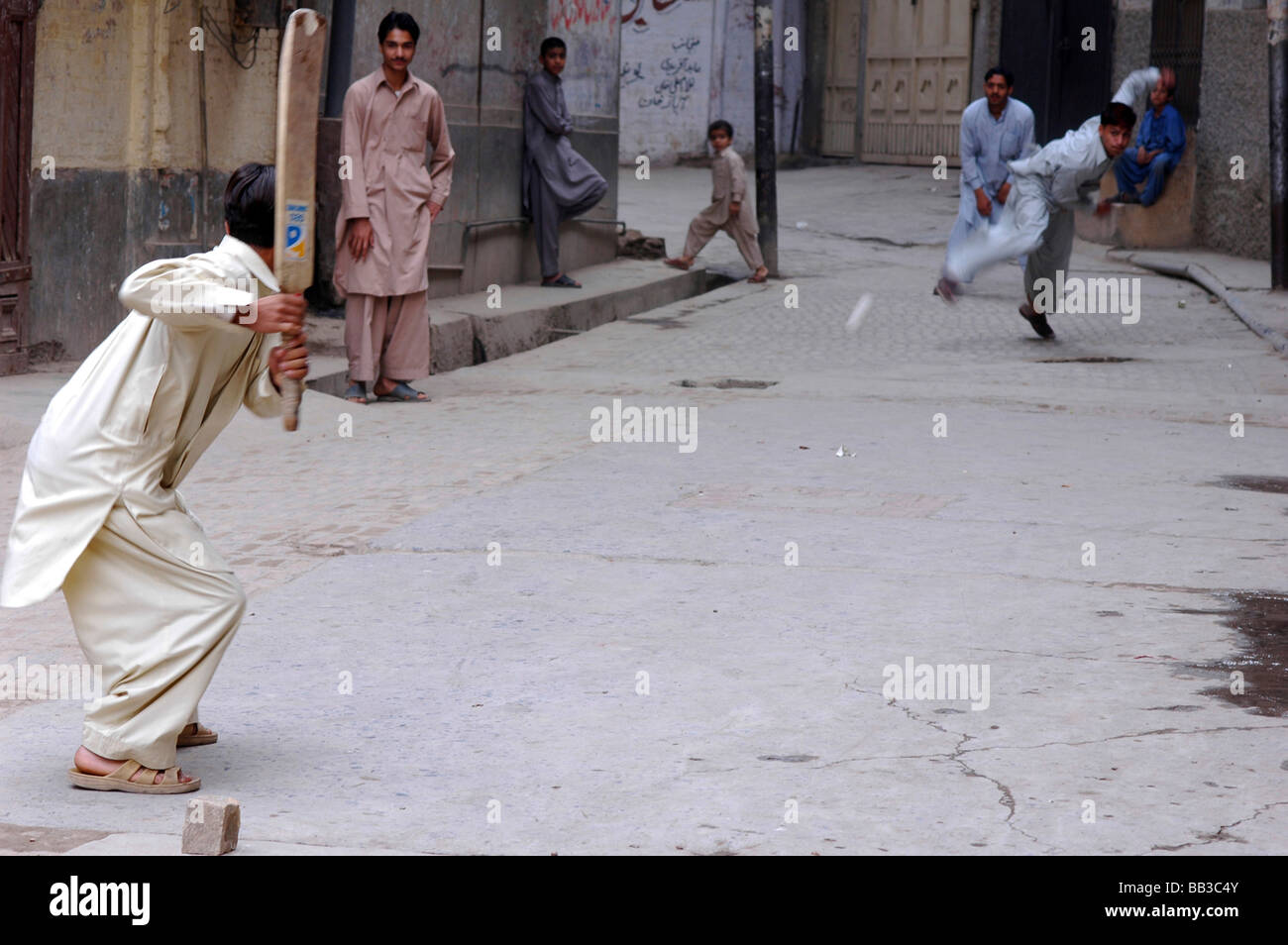 Pakistan, Peshawar. Group of young pakistani teenage boys dressed in grey & white punjabi suits Stock Photo