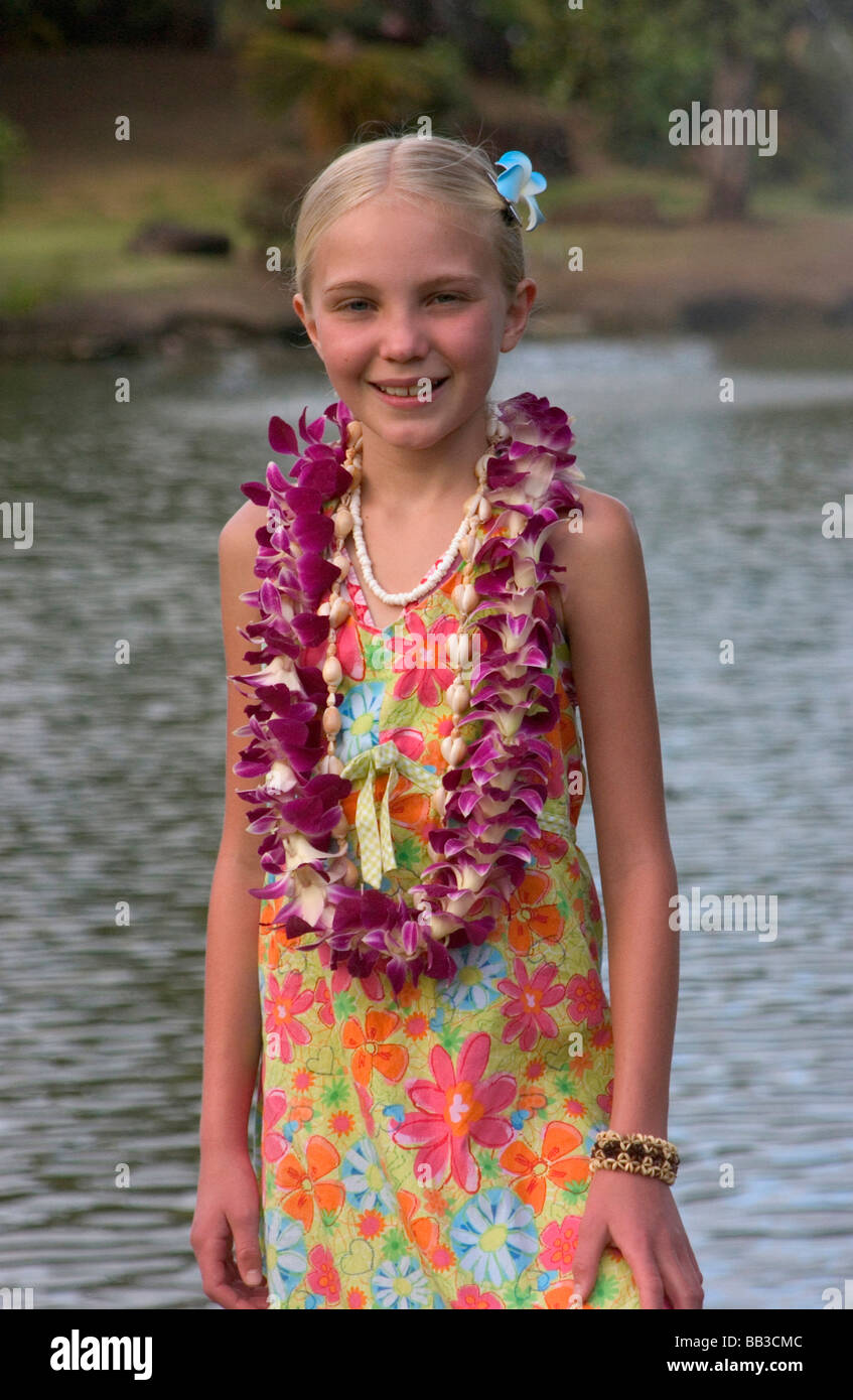 USA Hawaii Kauai Smith Family Luau girl tourist with lei at luau MR Stock Photo