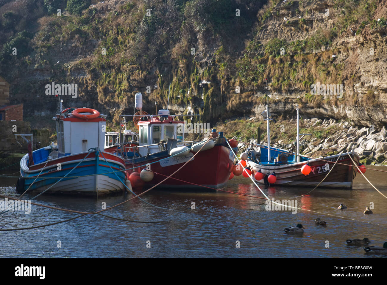 Fishing boats in the harbour at Staithes Yorkshire England Stock Photo ...