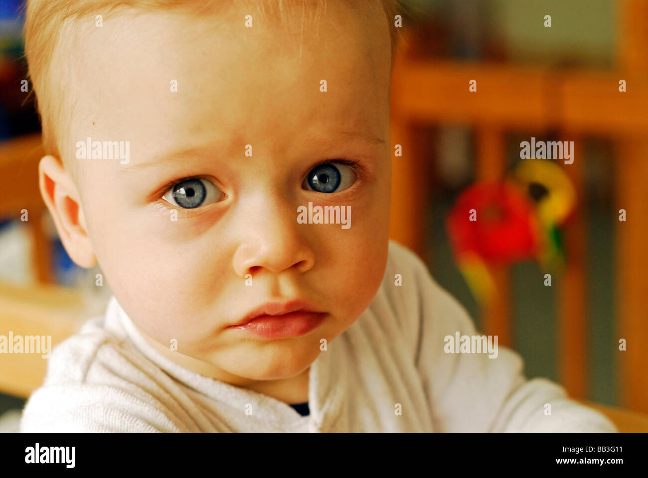 UKRAINE, Kiev. Portrait of a white blond baby boy with big blue eyes ...