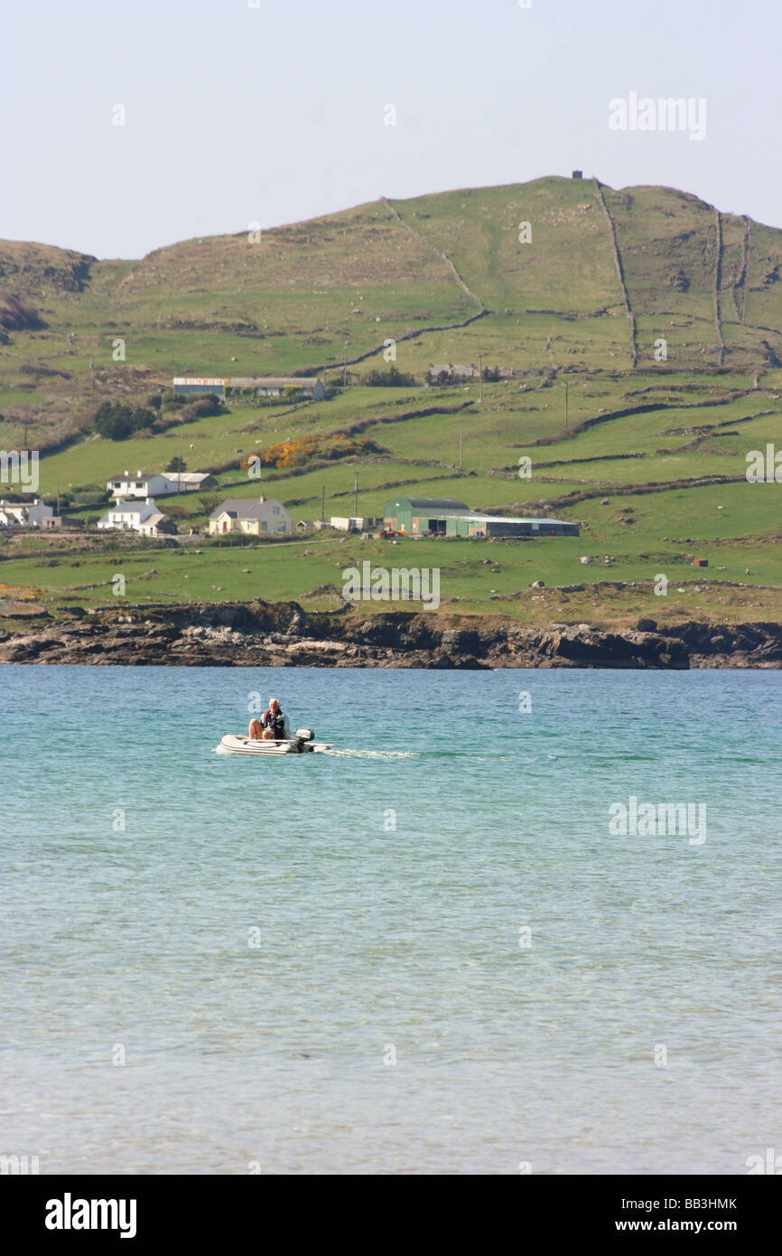 man in a small powered boat off the County Donegal coast at Portnoo, Ireland Stock Photo