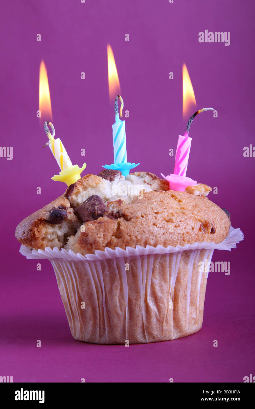Birthday muffin cake with three candles Stock Photo Alamy