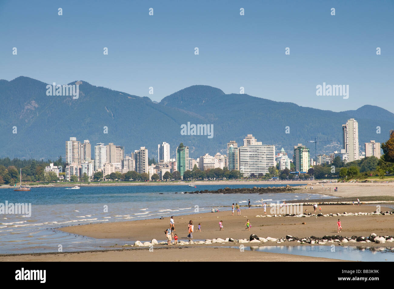 Kitsilano Beach park overlooking English Bay and the skyline of downtown Vancouver, BC, Canada