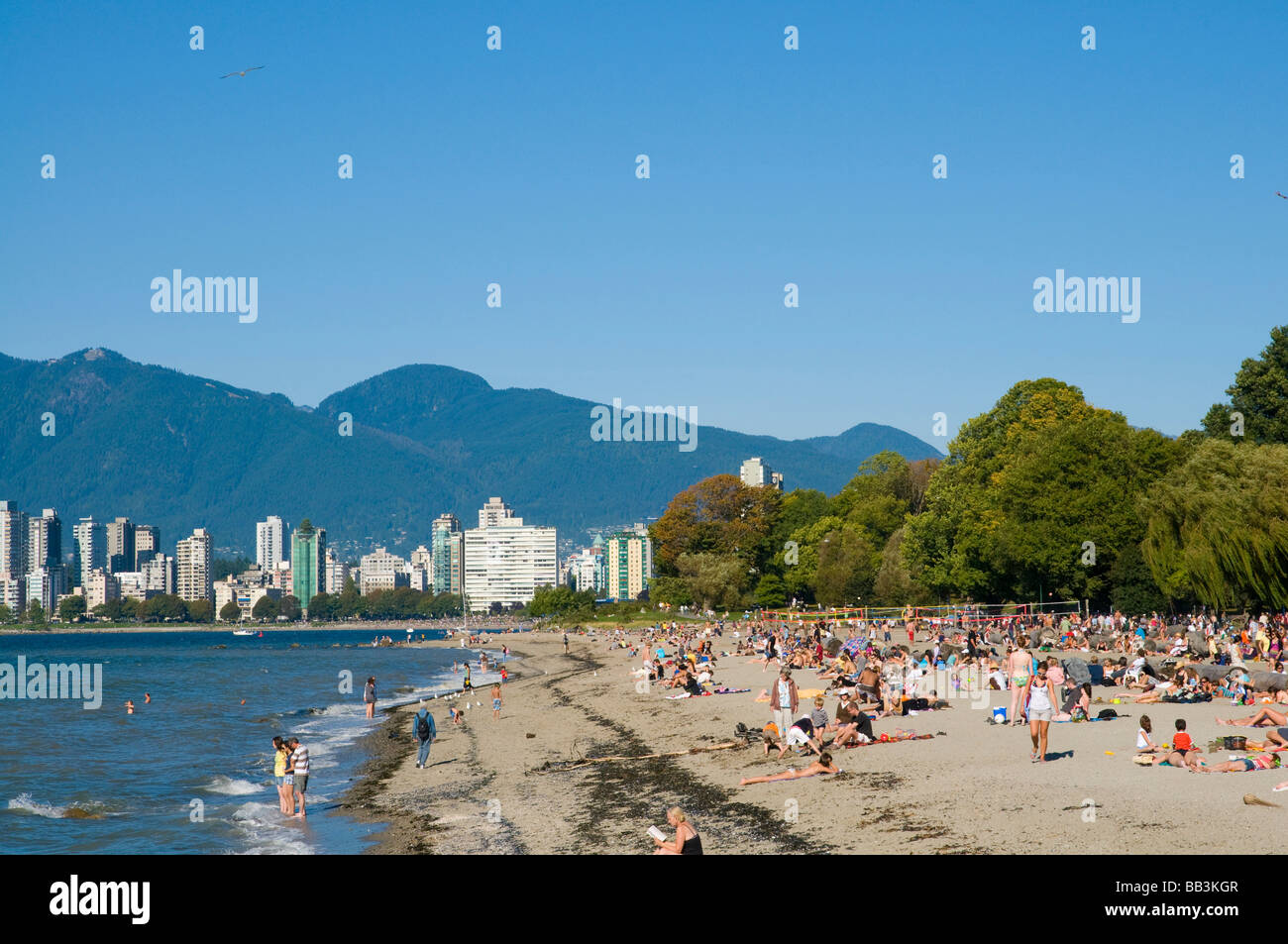 Kitsilano Beach park and swimming pool overlook English Bay and the skyline of downtown Vancouver, BC, Canada. Stock Photo