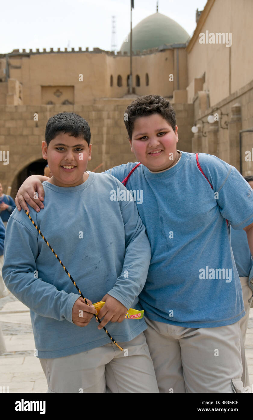 Two school Boys The Mosque of Muhammad Ali Pasha or Alabaster Mosque on the Citadel Cairo Egypt Stock Photo