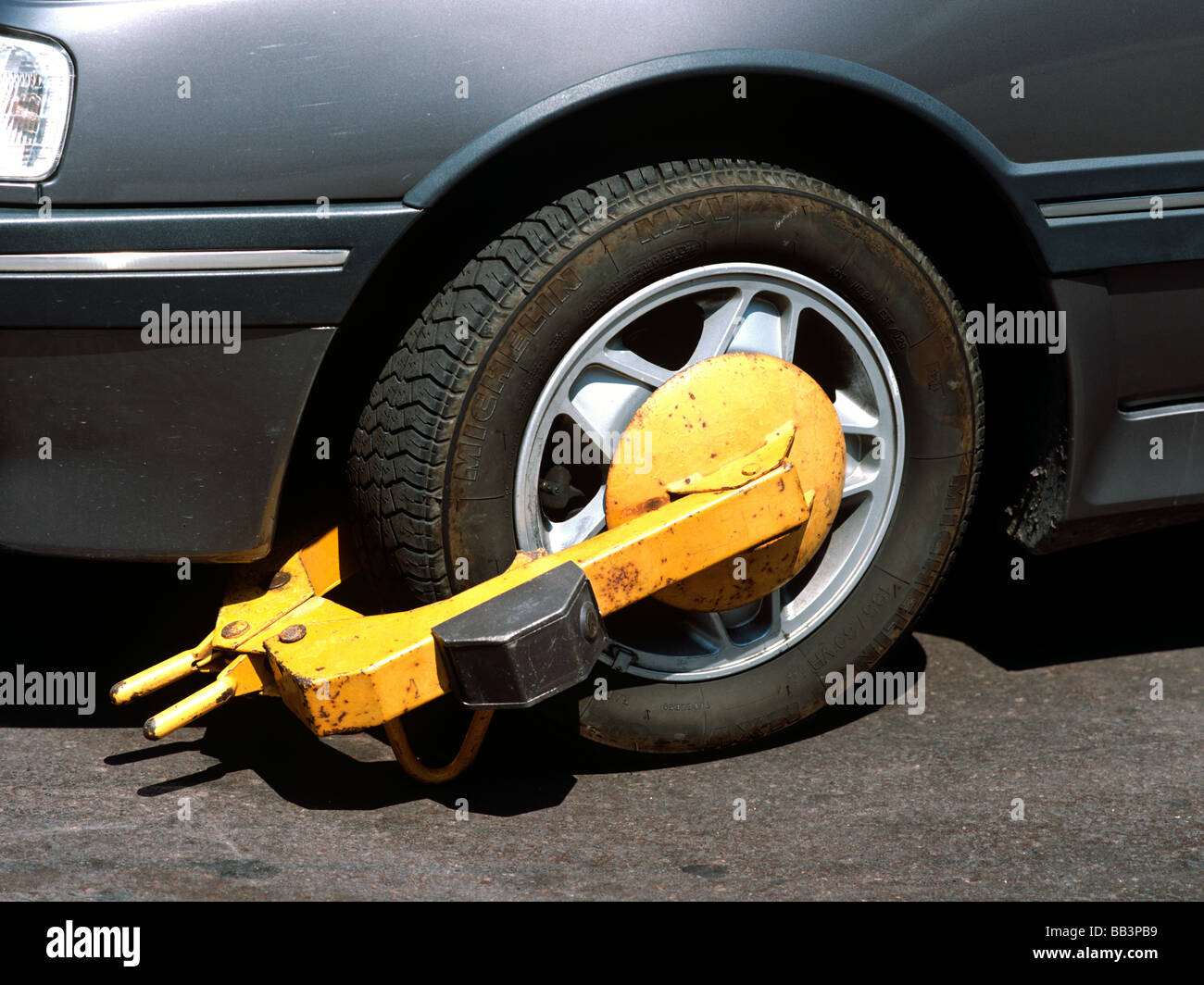 A wheel clamp on a vehicle in Saint Tropez South of France EU FR FRA France Provence Alpes Côte d Azur Department Var Stock Photo