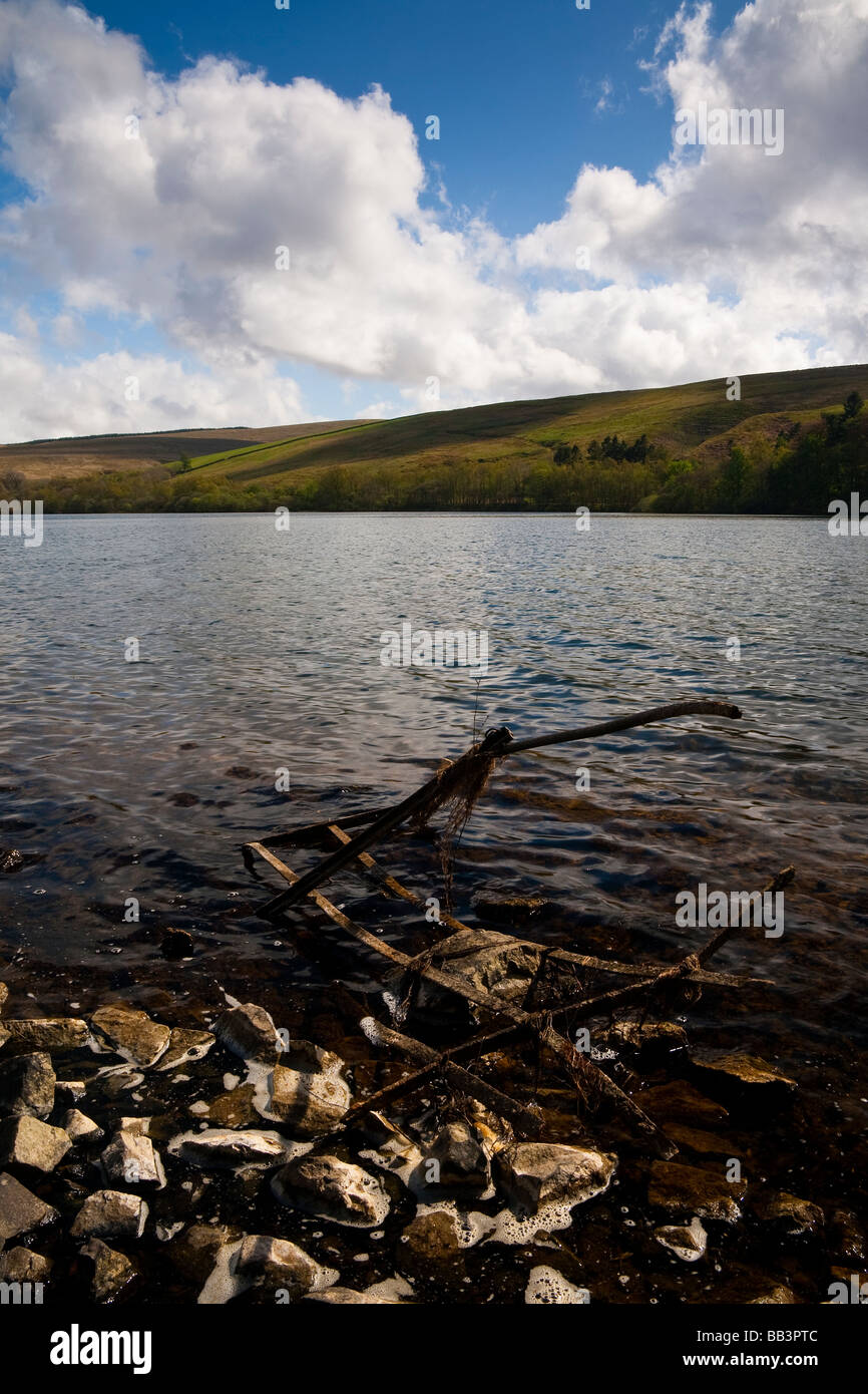 Rusting fence lying in Glenbuck Loch, Ayrshire, Scotland Stock Photo