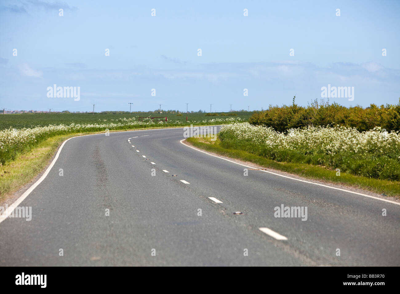 Corner bend in a single carriageway rural road focus on bend UK Stock Photo