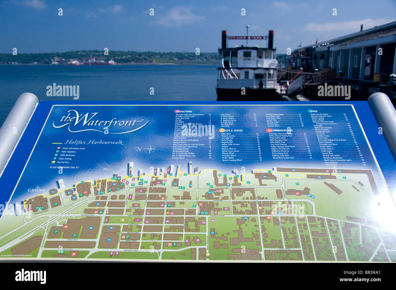 Canada, Nova Scotia, Halifax. Waterfront area map, Harbour Queen tour boat in distance. Stock Photo