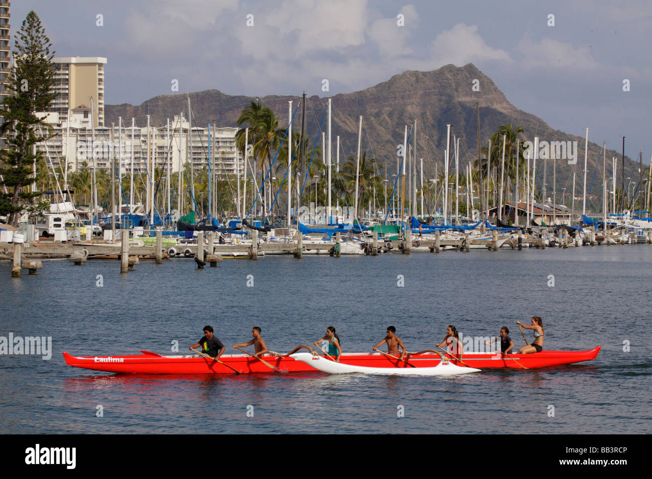 High school students practicing in outrigger canoes Ala Moana Beach