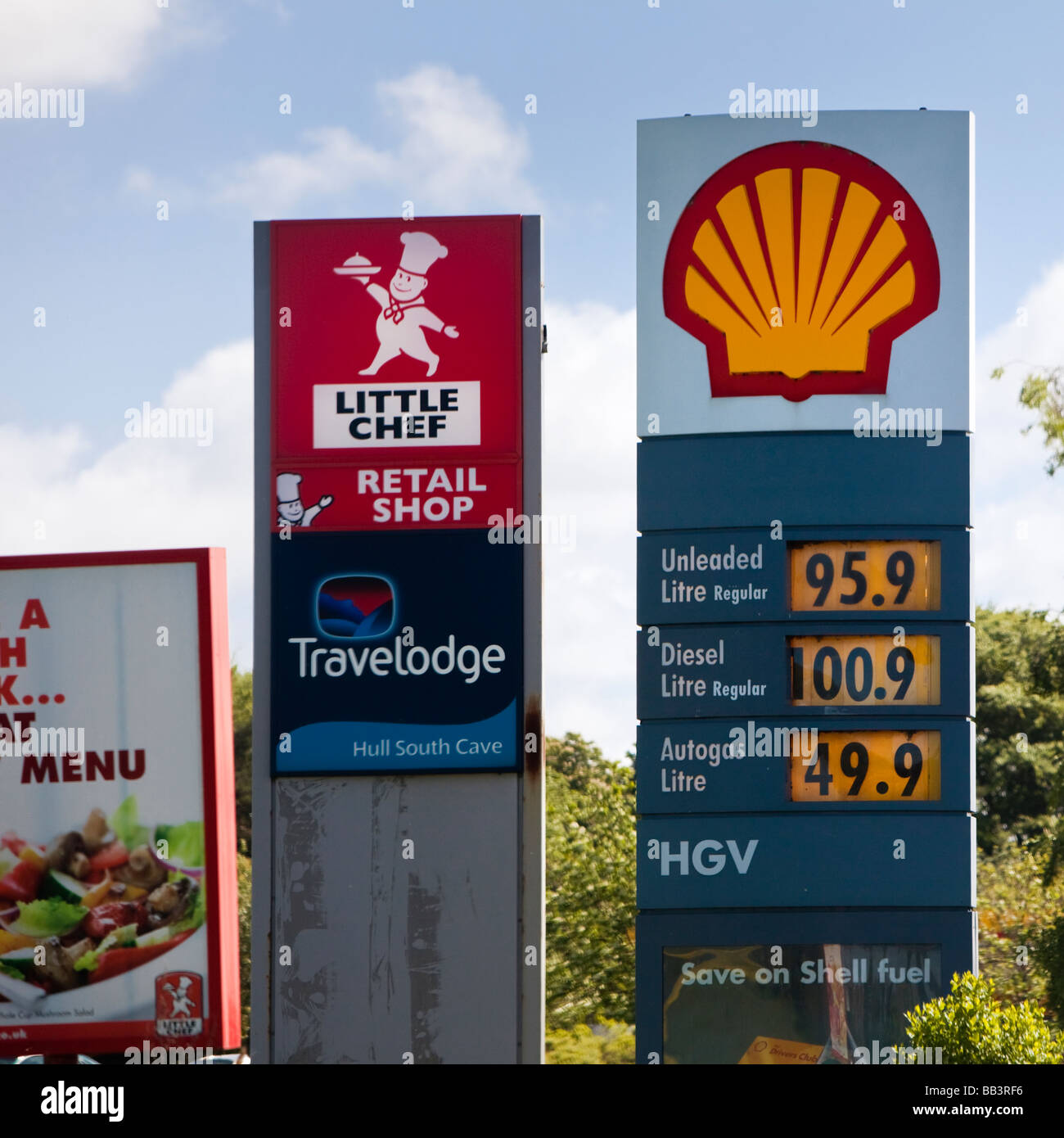 Petrol and roadside service area signage with autogas and services signs England UK Stock Photo