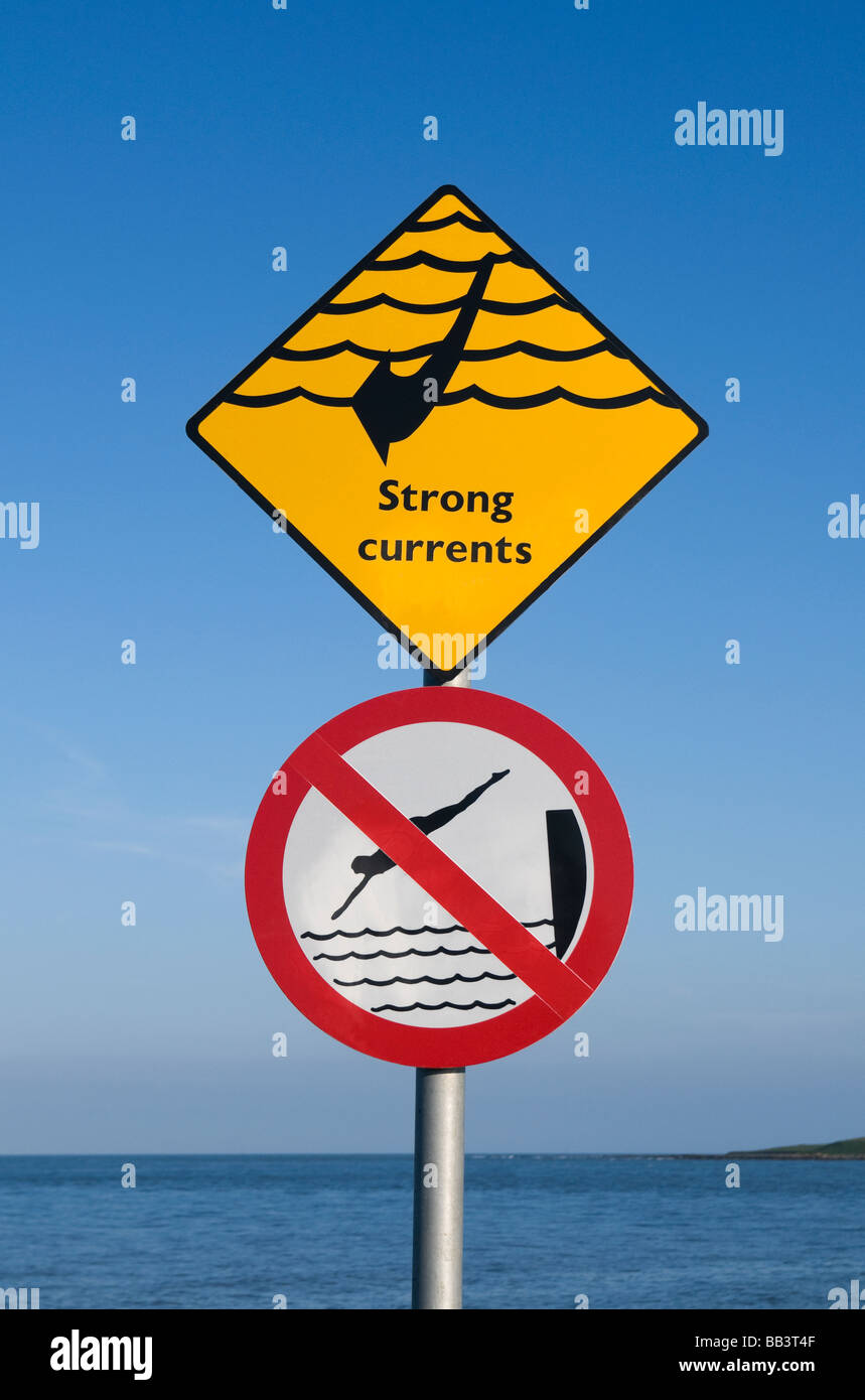 Signs at a swimming place at Skerries, north County Dublin, Ireland, warning of danger of strong currents and no diving Stock Photo