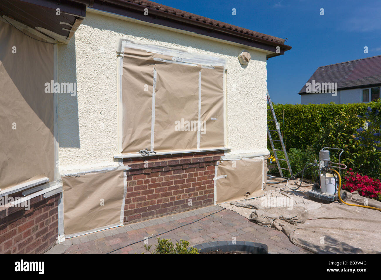 Preparations for external house painting Stock Photo