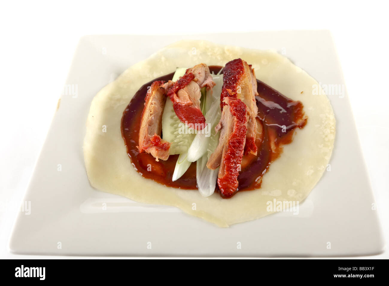 Peking duck a chinese delicacy with pancakes and hoisin sauce Stock