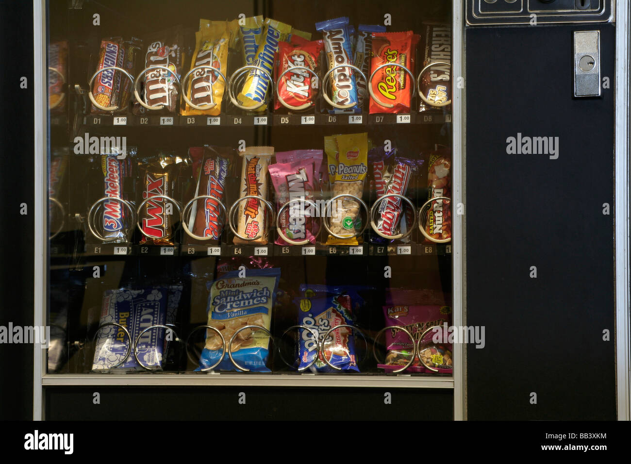 Vending machine filled with snack foods Stock Photo