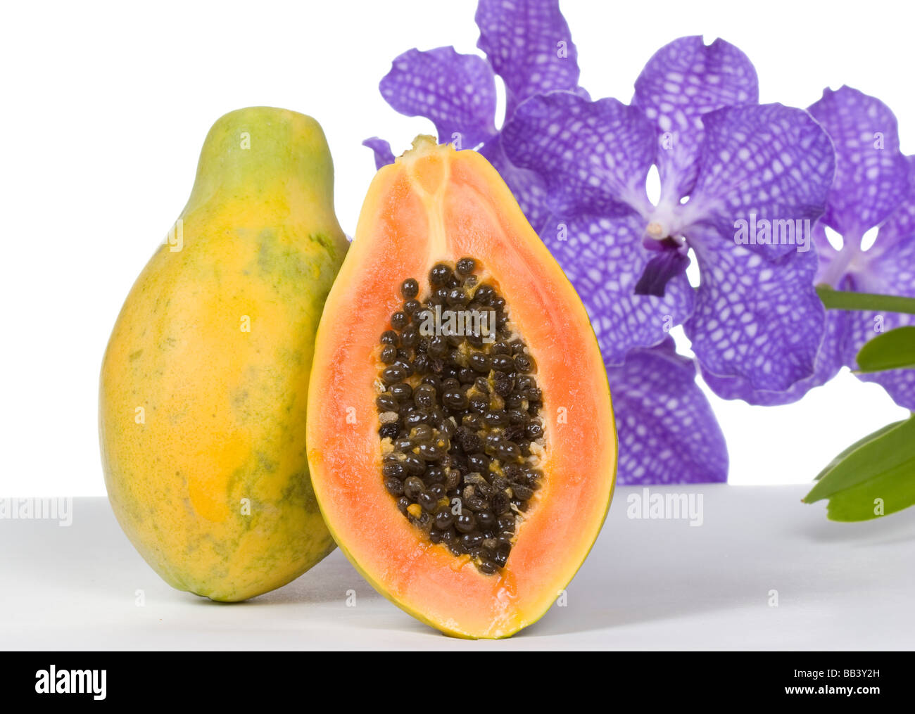 papaya with an orchid Stock Photo