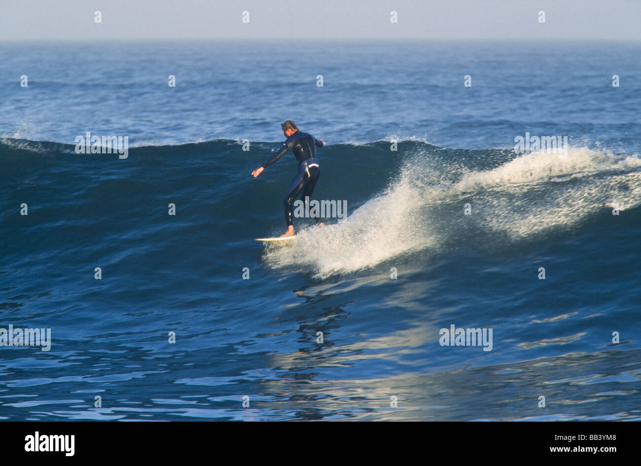 Surfer riding waves,longboard, Baja California Mexico Stock Photo