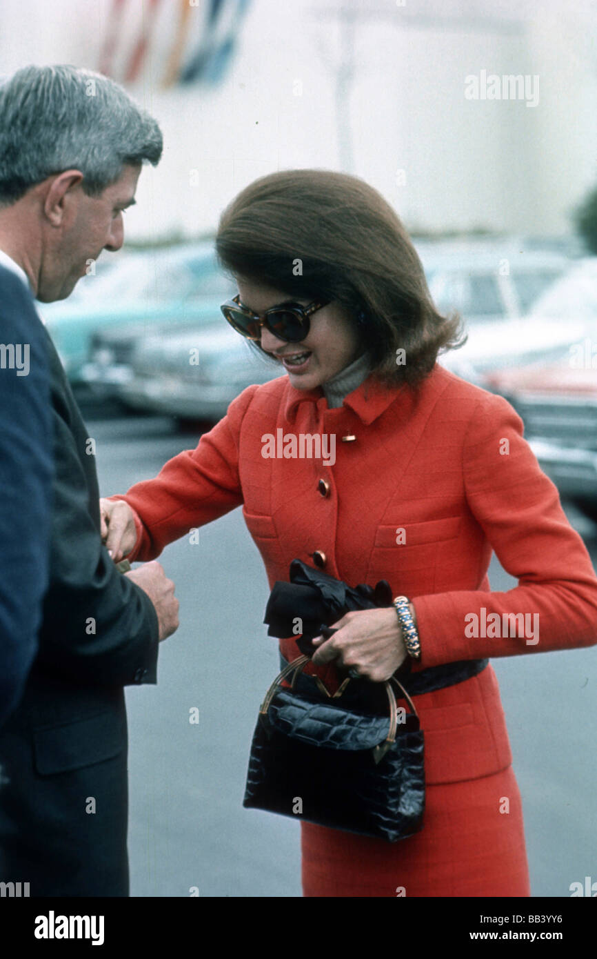 Jacqueline Kennedy Onassis wearing a black dress, sunglasses, and the Gucci  “Jackie” handbag in New York on September 18, 1968. Photo Credit Fairchild  Archives - University of Fashion Blog