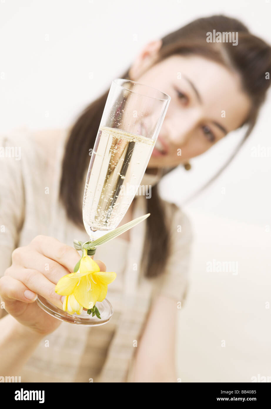 Woman holding a glass of sparkling wine Stock Photo - Alamy
