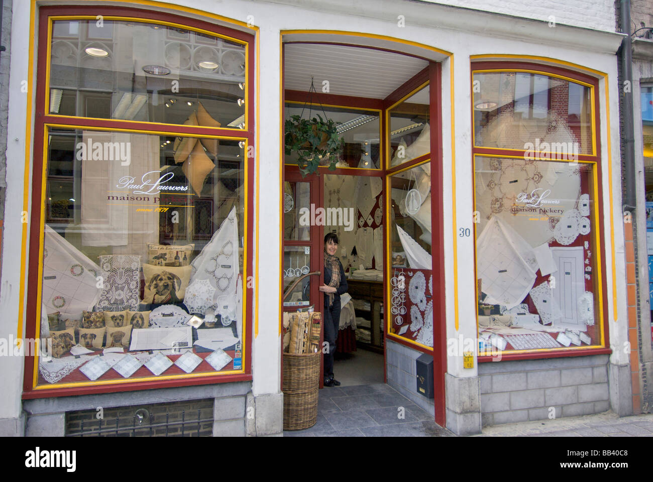 Europe, Belgium, West Flanders, Bruges, Belgian lace shop with store owner (MR PR Stock Photo