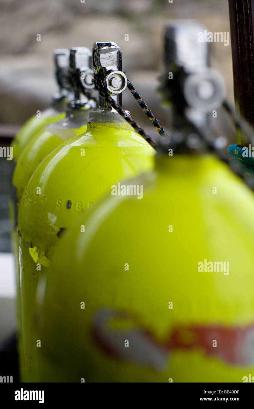 Row of scuba diving compressed air cylinders on a boat in Arraial do Cabo, Brazil Stock Photo
