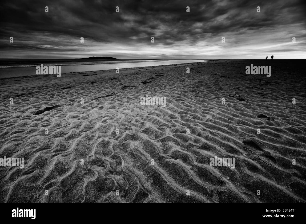 Footprints in the sand in evening low tide, Malahide Beach, Co. Dublin, Ireland. Stock Photo