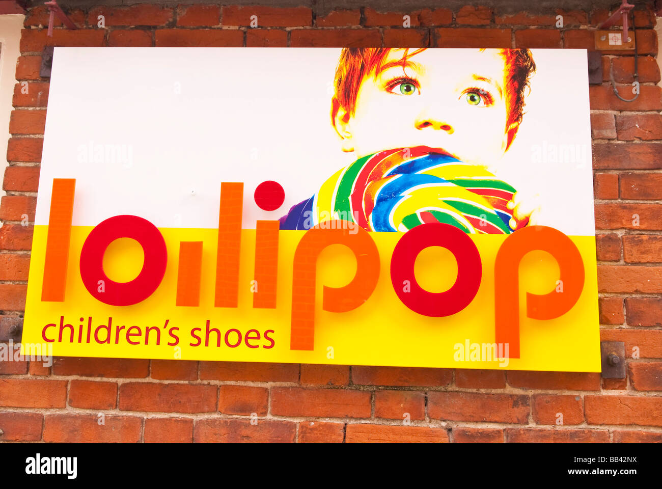 The Lolipop children's shoe shop sign logo outside a store in Beccles