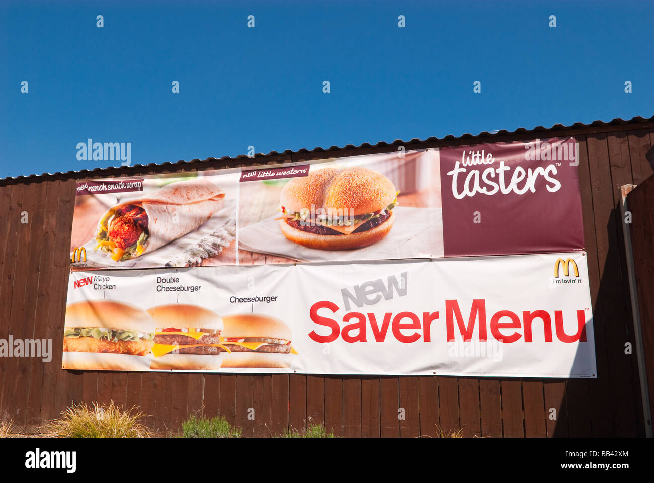 A menu on the outside wall of a mcdonalds restaurant in the Uk Stock Photo