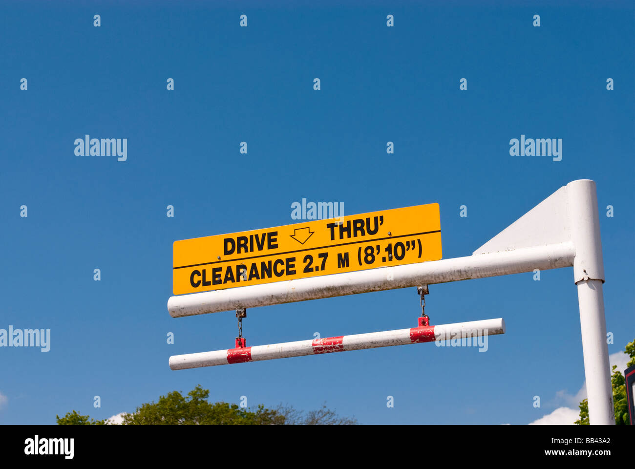 A sign stating maximum clearance height for vehicles at a uk mcdonalds drive thru restaurant Stock Photo