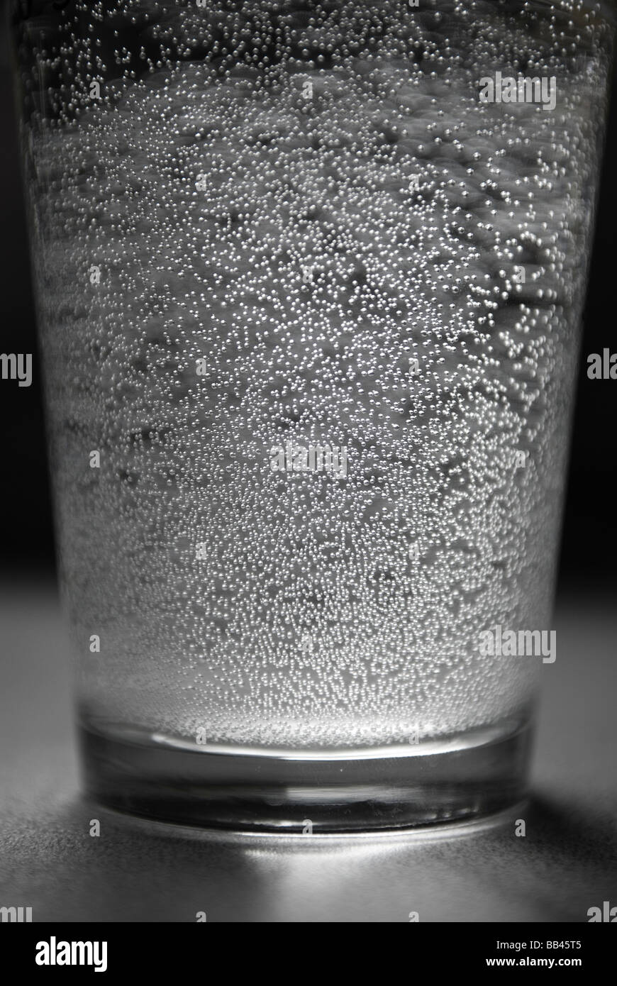Glass of water with lots of tiny bubbles Stock Photo Alamy