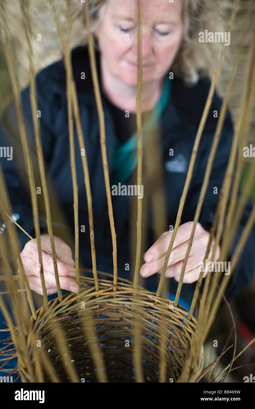 Woman making a basket Stock Photo