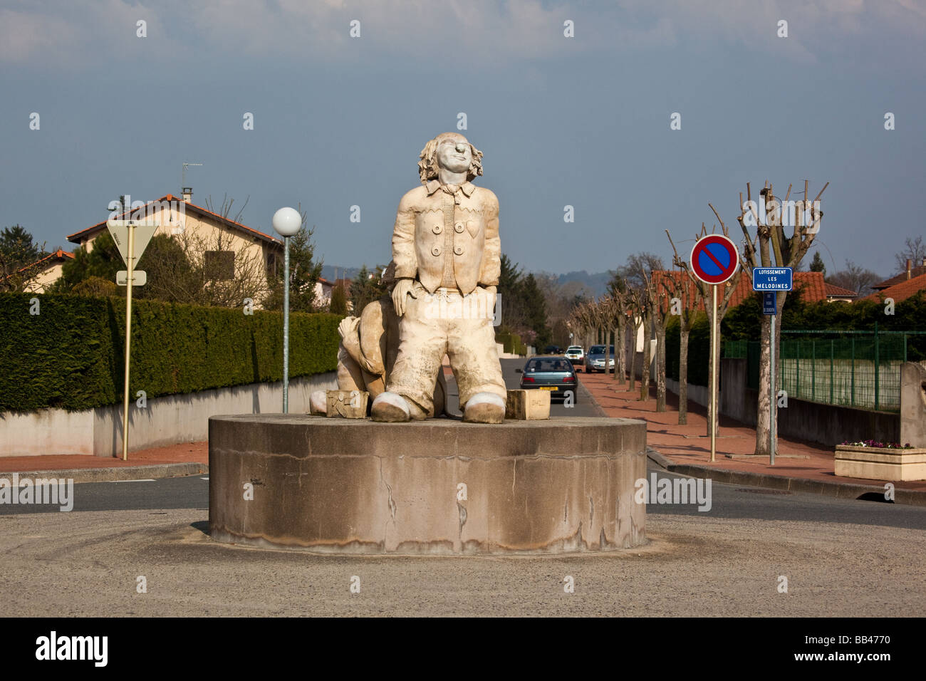 Statue of two men on roundabout at intersection of Rue du Geyser and Rue   Pierre de Coubertin in Montrond Les Bains near Saint Stock Photo