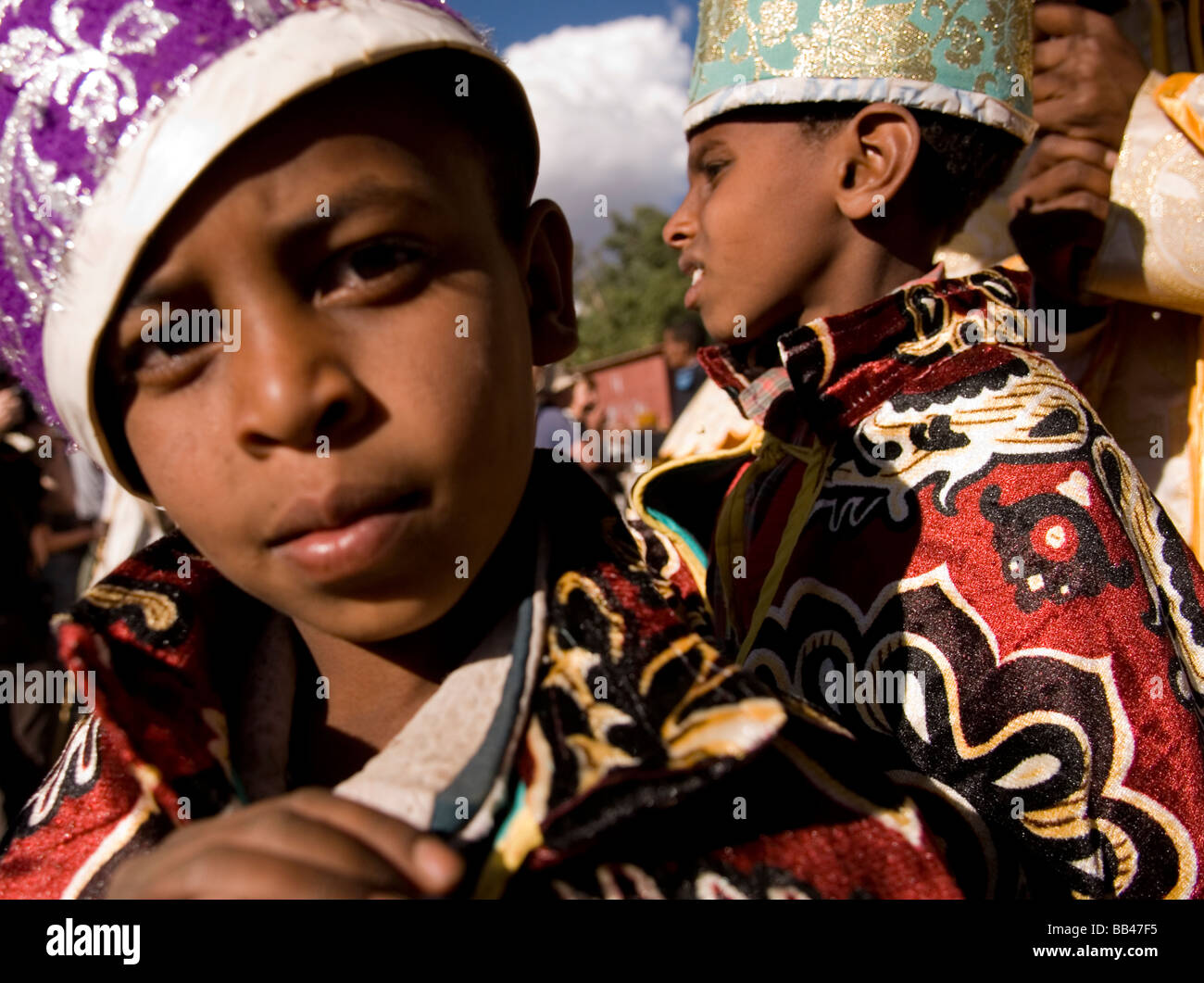 Young boys dressed in ceremonial clothes attending procession during Timkat in Lalibela, Ethiopia. Stock Photo