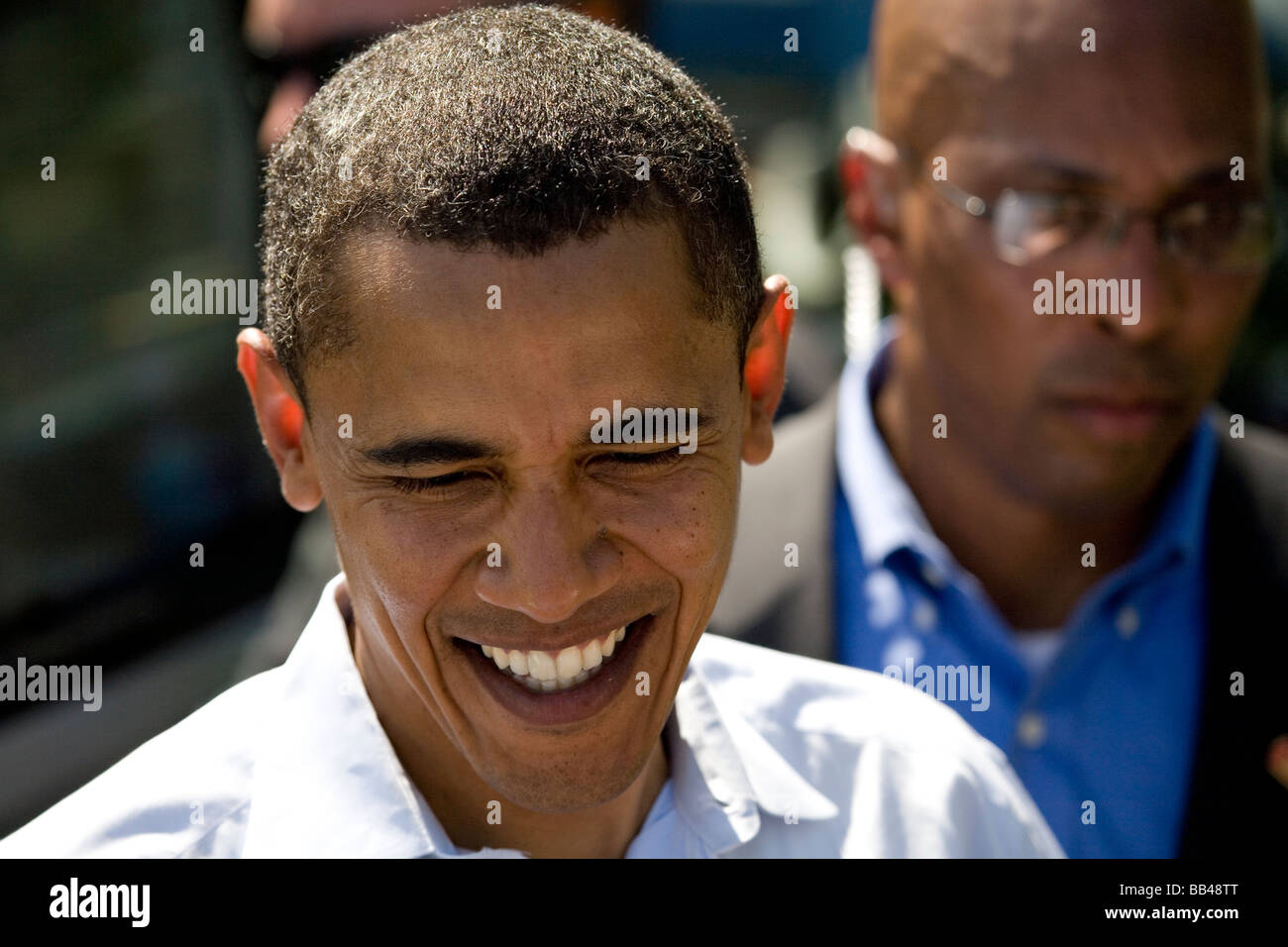 Presidential candidate Barack Obama smiles in front of Secret Service agent while greeting members of the crowd following the la Stock Photo