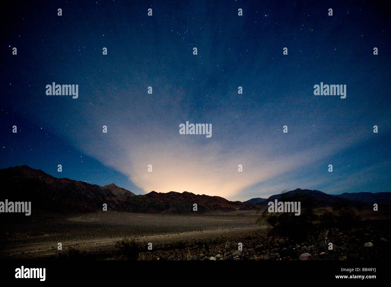 Lights from Las Vegas spill over Death Valley National Park, California, USA. Stock Photo
