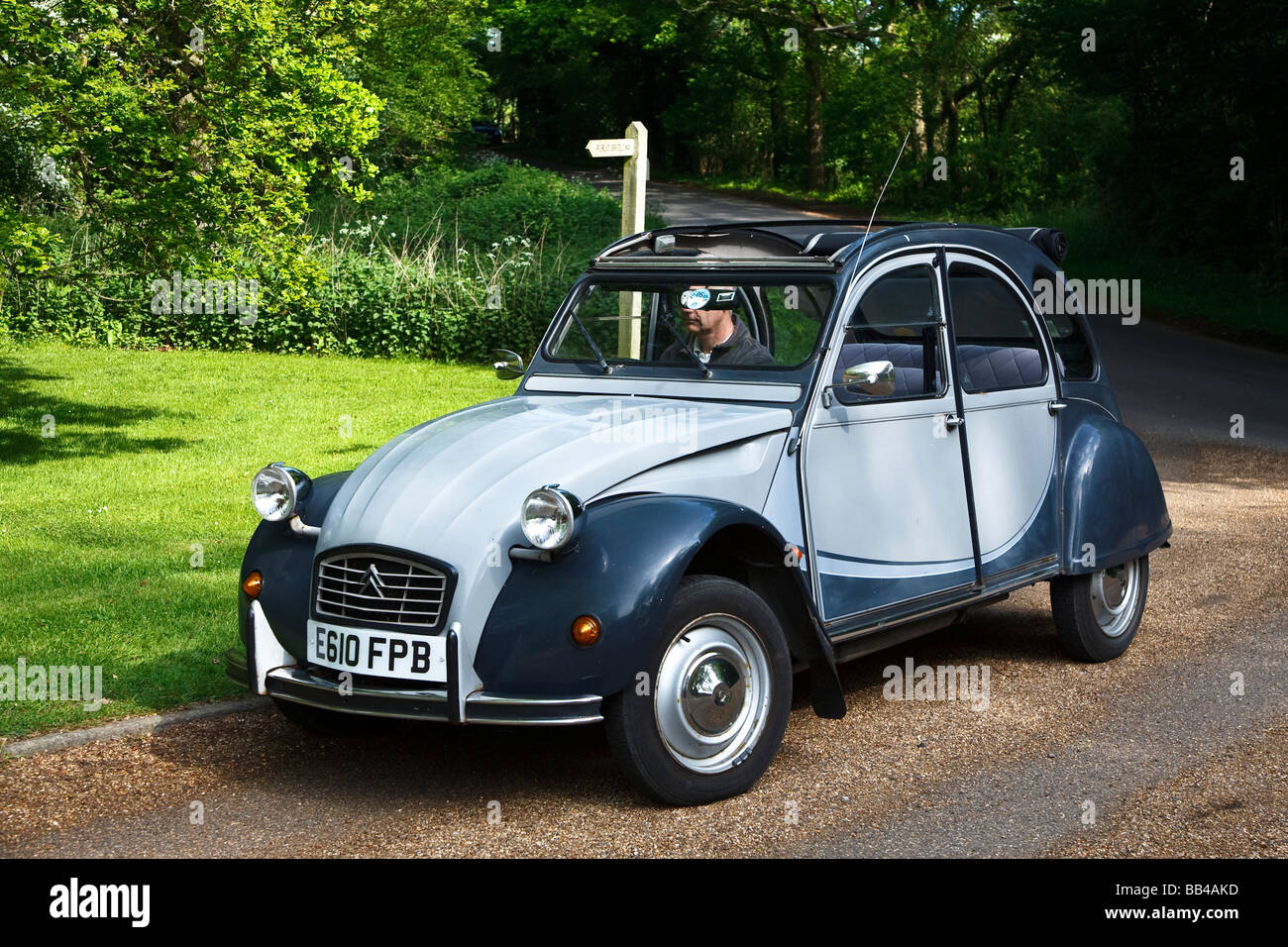 A vintage Citroen 2CV in a counrylane in West Sussex, United Kingdom, Great Britain, England. UK 2009 Stock Photo