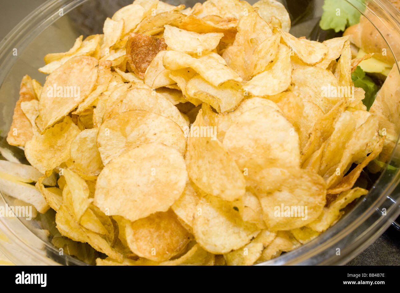 Bowl of crisps provided as party food at a family celebration Stock Photo