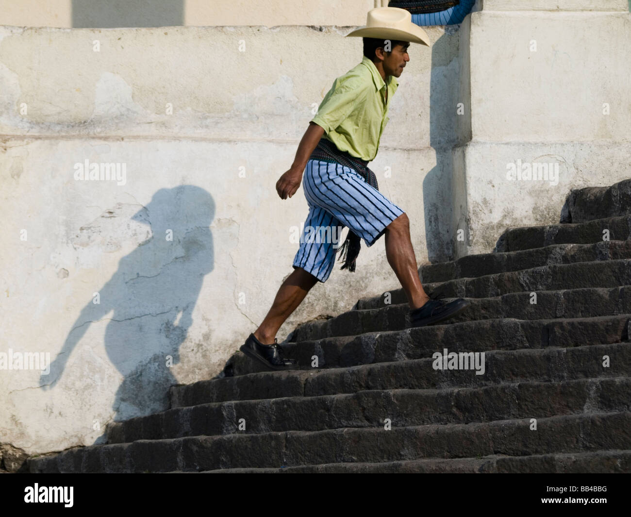 Villagers walking up steps into church Stock Photo Alamy