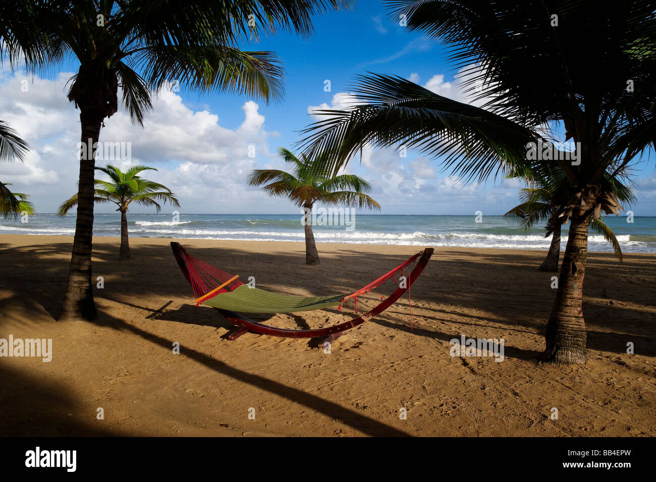 View of a Hammock on a Palm Covered Beach Isla Verde Puerto Rico Stock Photo