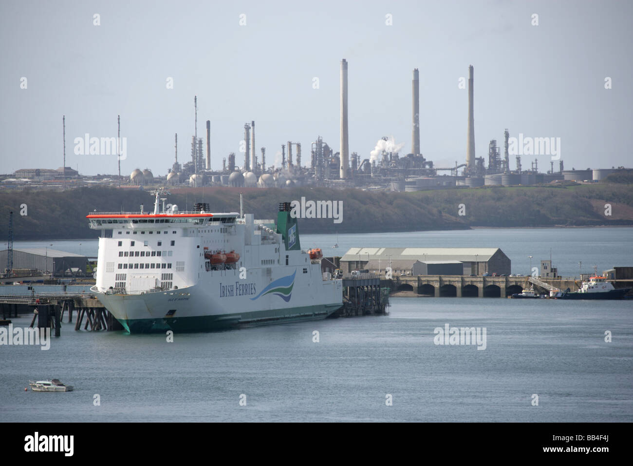 Town of Milford Haven, Wales. Ferry berthed alongside the Cleddau ferry terminal with the Texaco Oil Refinery in the background. Stock Photo