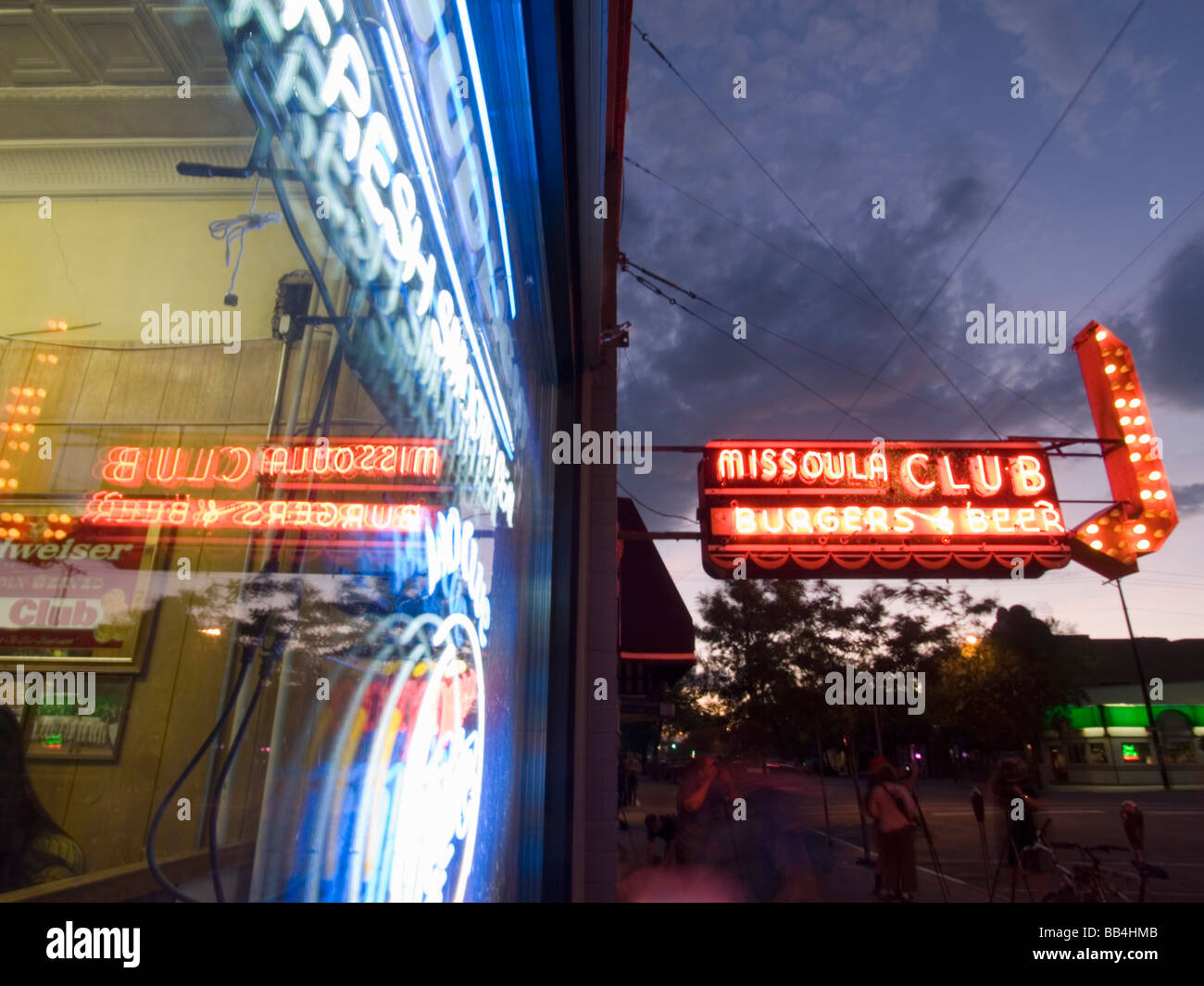 A neon sign for a bar reflected in the bar window Stock Photo - Alamy
