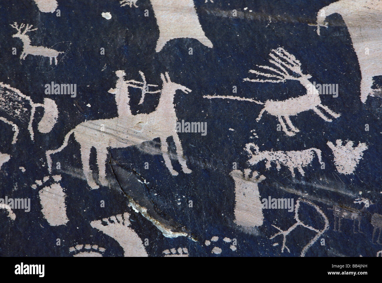Prehistoric and historic petroglyphs at Newspaper Rock in Utah Stock Photo