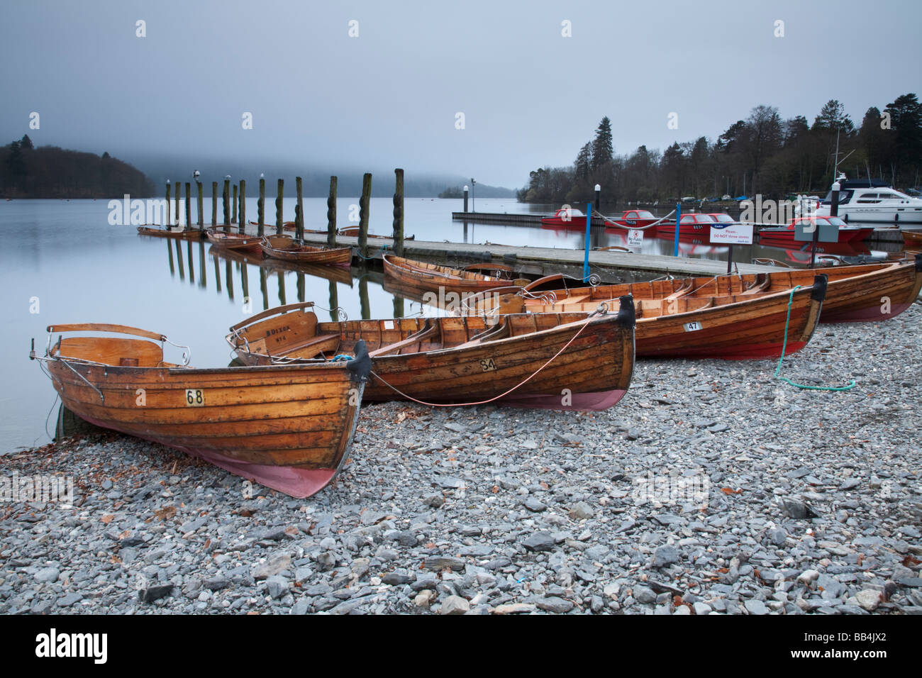 Rowing boats on the shore of Lake Windermere at Bowness on Windermere Lake District Cumbria Uk Stock Photo