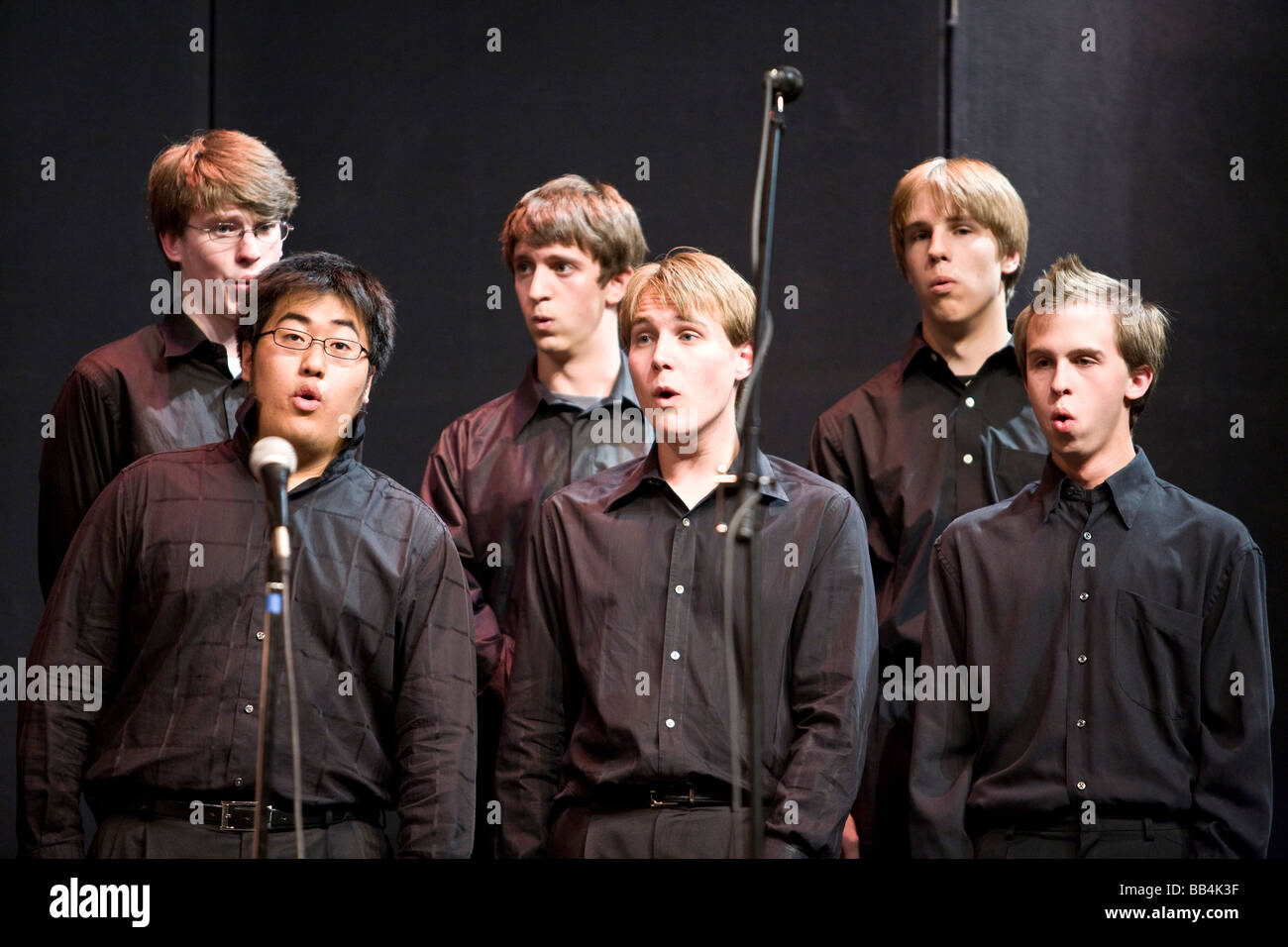 A choir of teenage boys singing in a sound studio Stock Photo Alamy