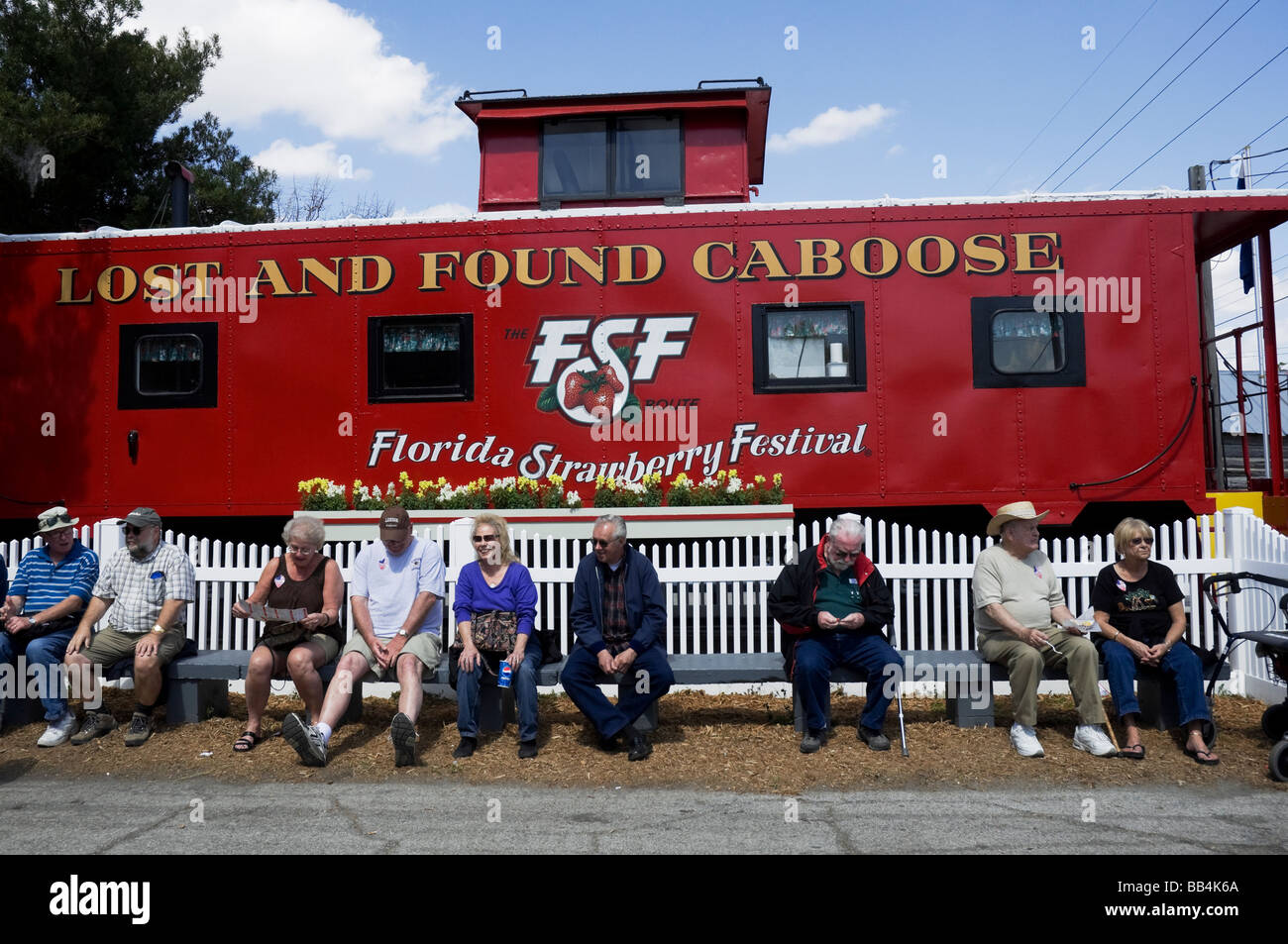 little red caboose and people at the Florida Strawberry Festival Plant City Florida Stock Photo