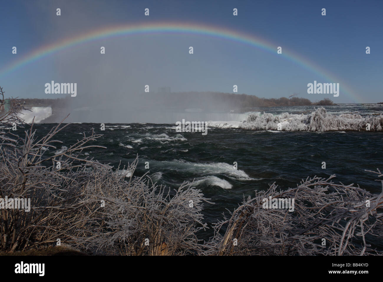 Niagara River With Rainbow Above Horseshoe Falls - Canada Stock Photo