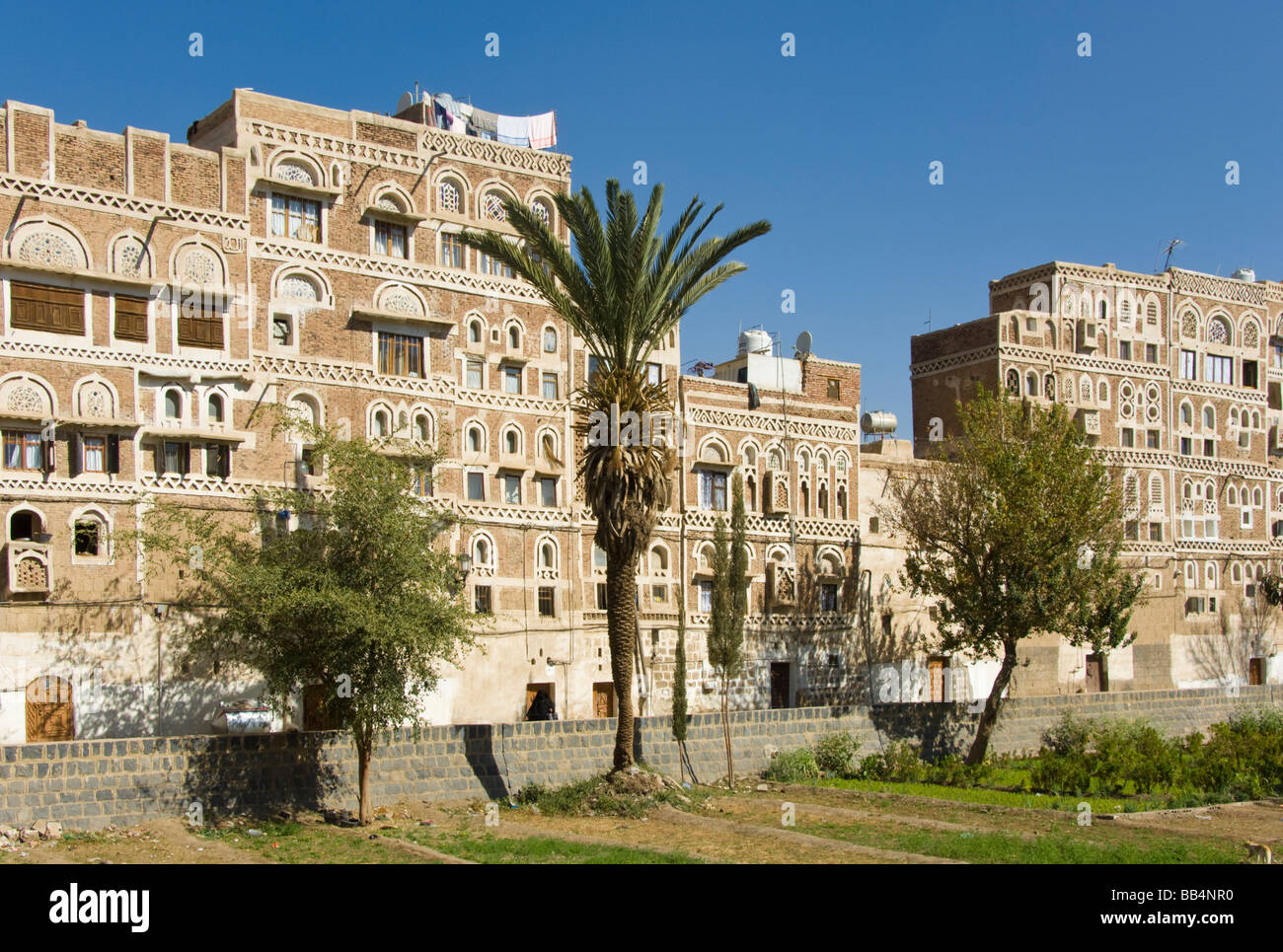 Traditional garden bustan with buildings in the old town district of Sana'a Yemen Stock Photo