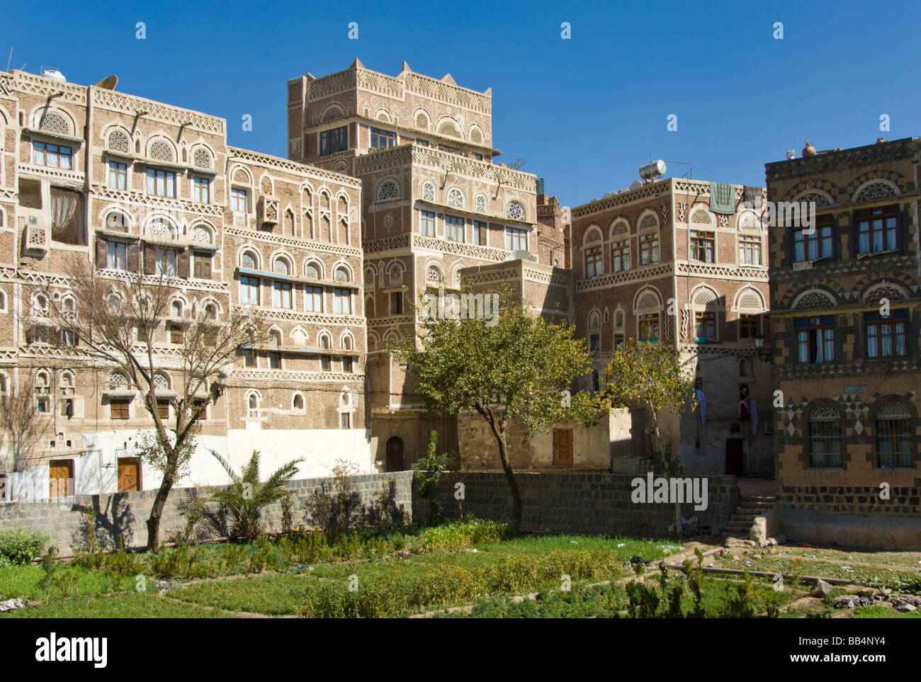 Traditional garden bustan with buildings in the old town district of Sana'a Yemen Stock Photo