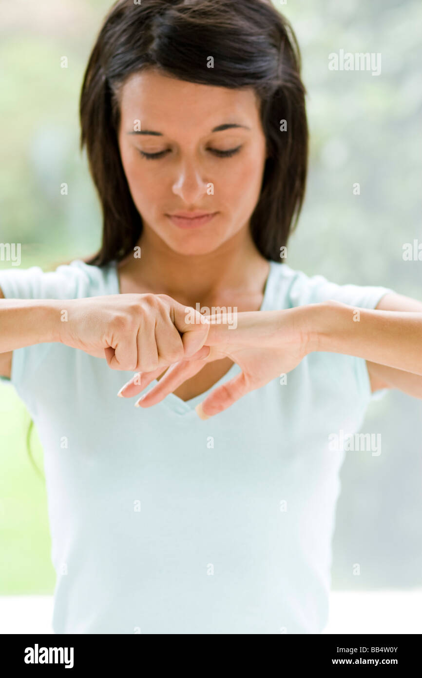 Female cracking knuckles hires stock photography and images Alamy