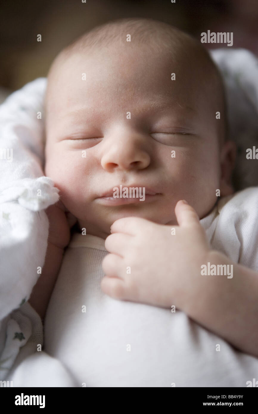 closeup portrait of newborn baby sleeping with hand resting close to his face Stock Photo Alamy